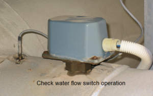 Check water flow switch operation during chiller maintenance
